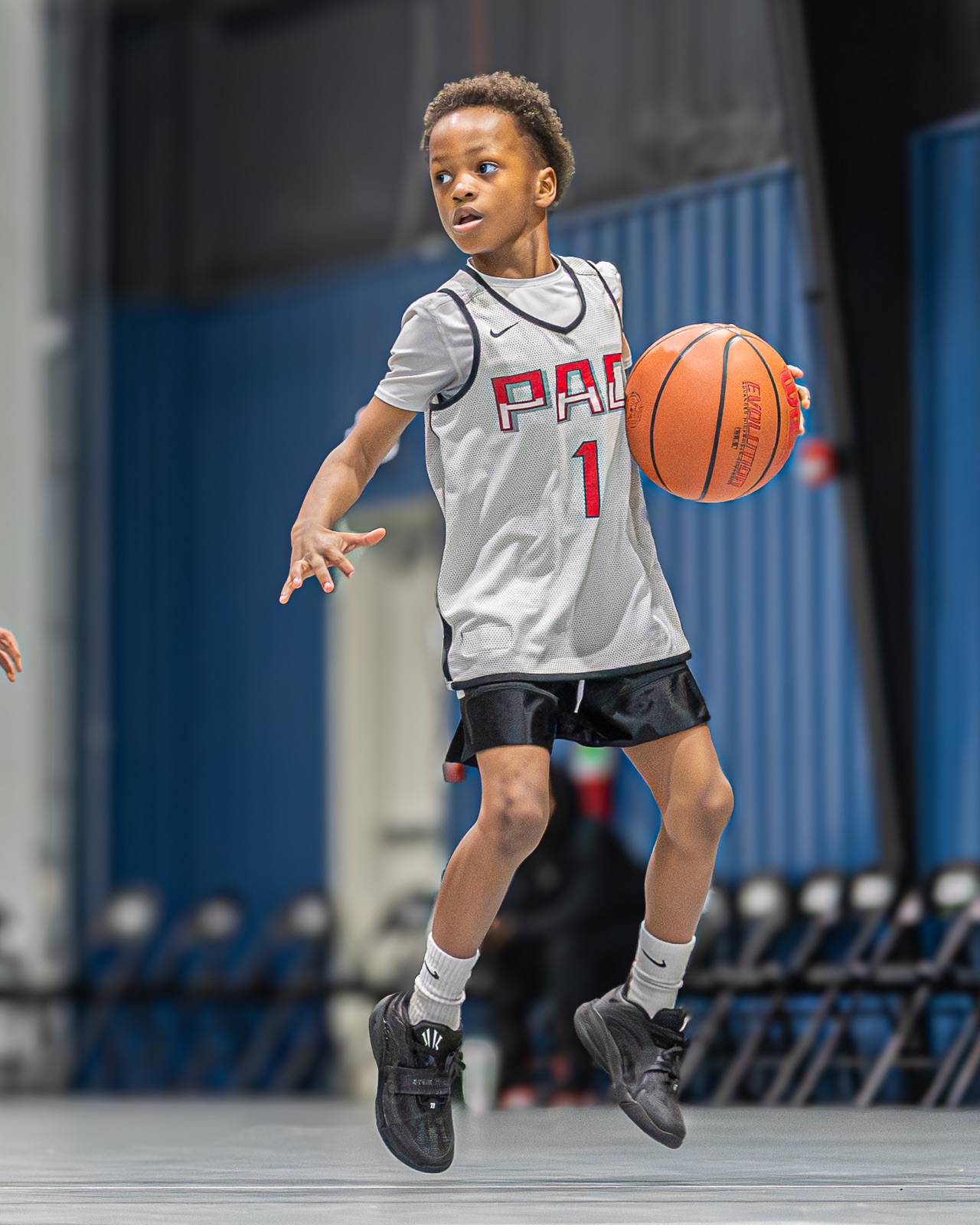 Player pushing the ball up the court